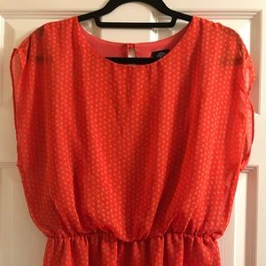 Draped orange polka dotted blouse
